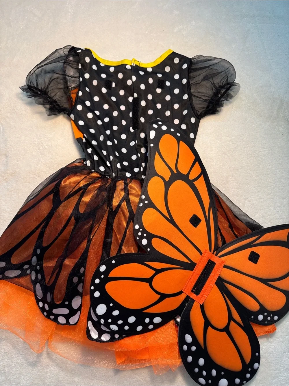 Halloween children’s orange and black monarch butterfly costume. Removable wings